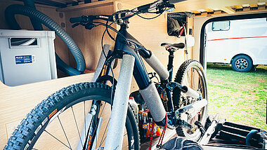 Garage in mobile home from inside with stored e-bikes